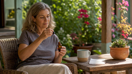 Woman measuring CBD oil dose at kitchen table