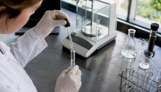 Lab technician pipetting CBD extract